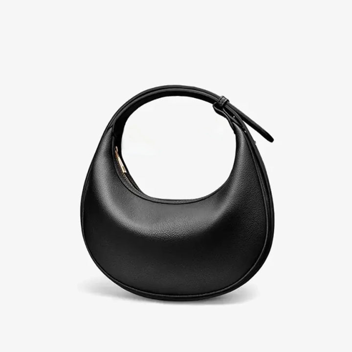 Sac rond femme vert en éco-cuir, parfait pour ajouter une touche de style.