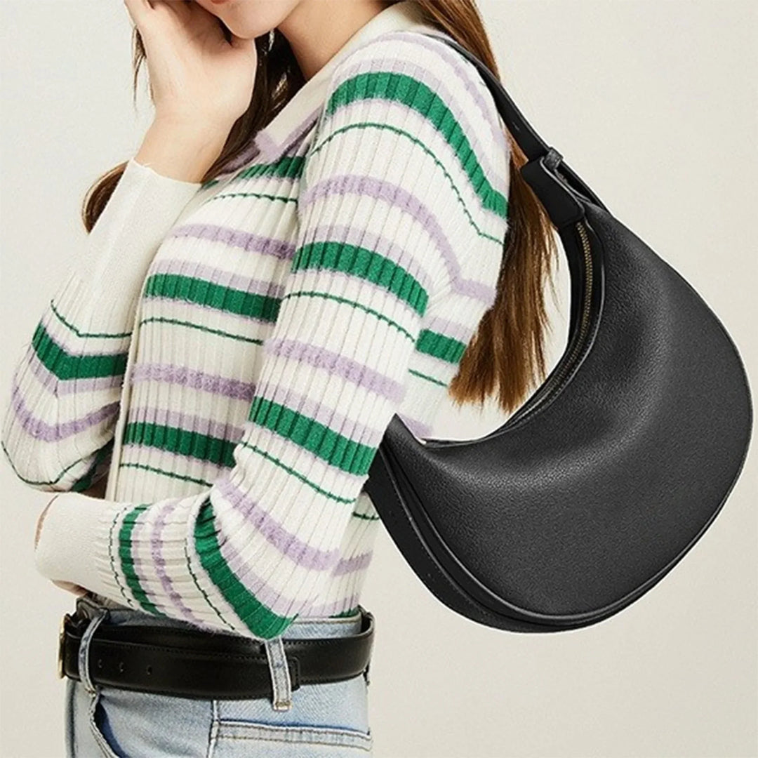 Sac bandoulière rond femme en éco-cuir, style mode, disponible en vert, beige et noir.