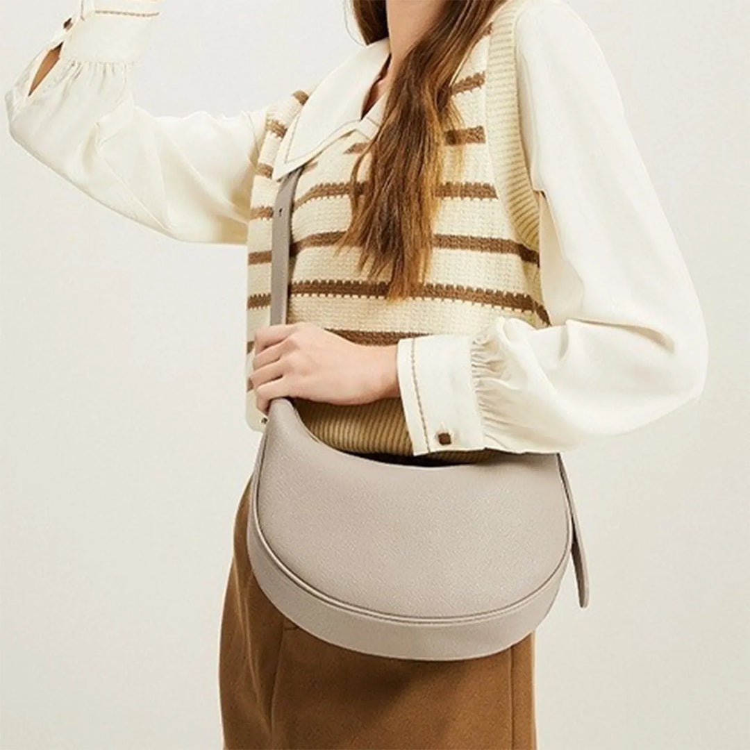 Élégant sac à main rond pour femme, en éco-cuir, un accessoire chic et intemporel.