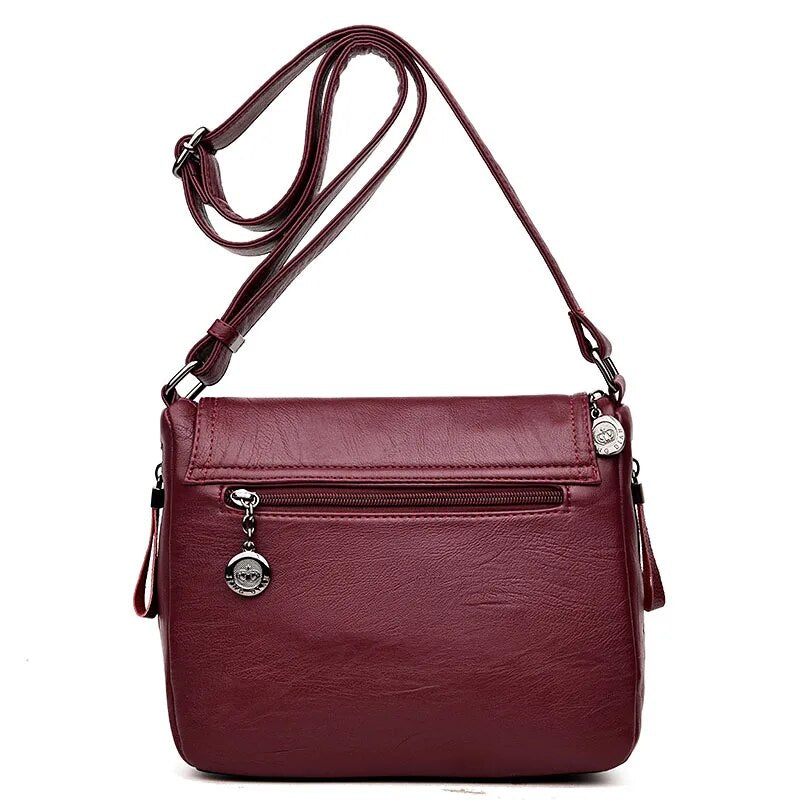 Besace élégante femme en similicuir, avec bandoulière ajustable, pour un style décontracté chic.