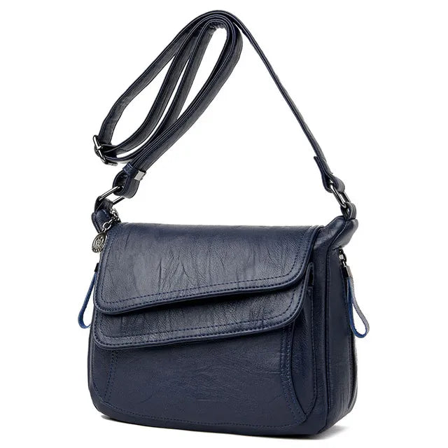 Sac chic femme en similicuir, modèle besace bandoulière, alliant confort et style au quotidien.