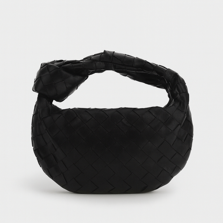 Sac à main tissé élégant en cuir synthétique pour femme. Accessoire mode chic et polyvalent.