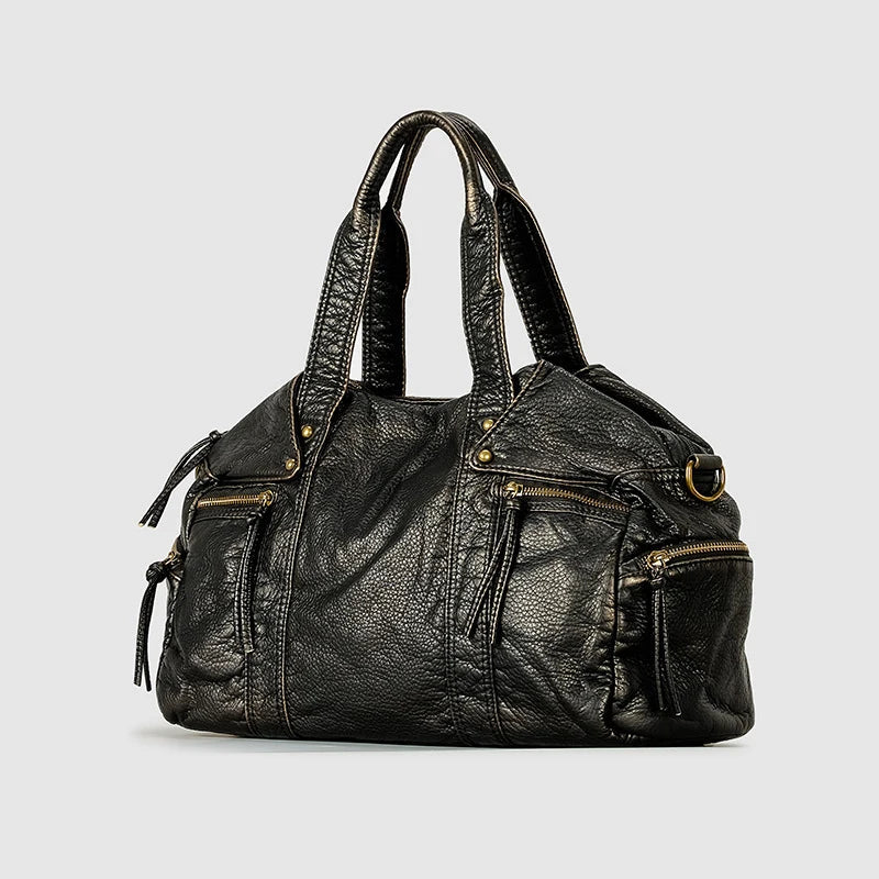 Sac d'épaule femme spacieux, design vintage noir. Idéal comme sac de travail ou pour les essentiels quotidiens.
