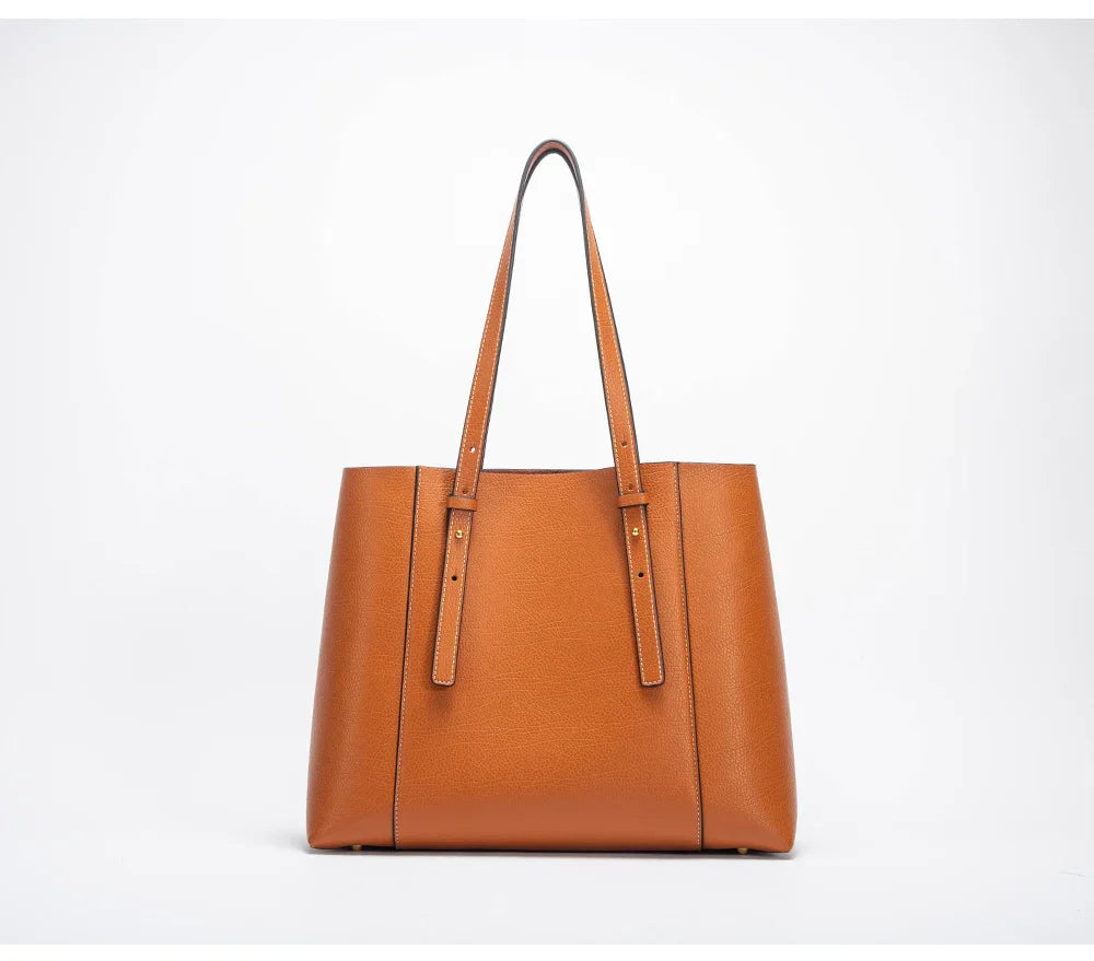 Fermeture éclair robuste et détails métalliques dorés sur le sac de cours Olympe noir pour femme.