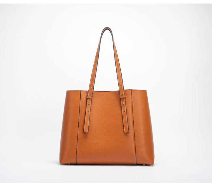 Fermeture éclair robuste et détails métalliques dorés sur le sac de cours Olympe noir pour femme.