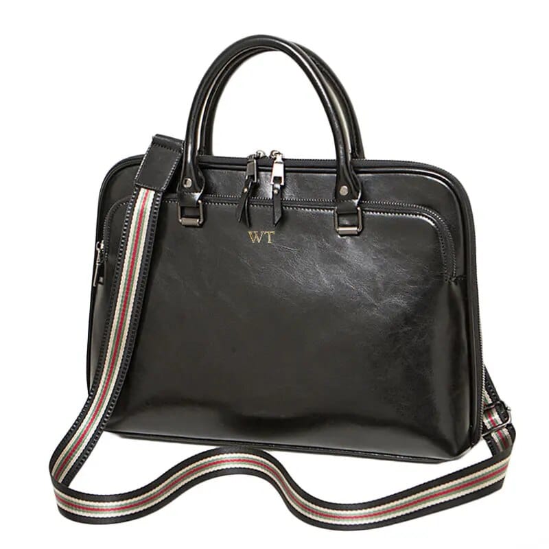 Sacoche ordinateur en cuir noir pour femme, parfait pour le travail et le transport d'un laptop 14 pouces.