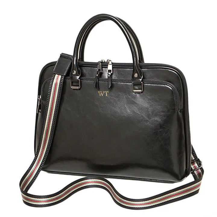 Sacoche ordinateur en cuir noir pour femme, parfait pour le travail et le transport d'un laptop 14 pouces.