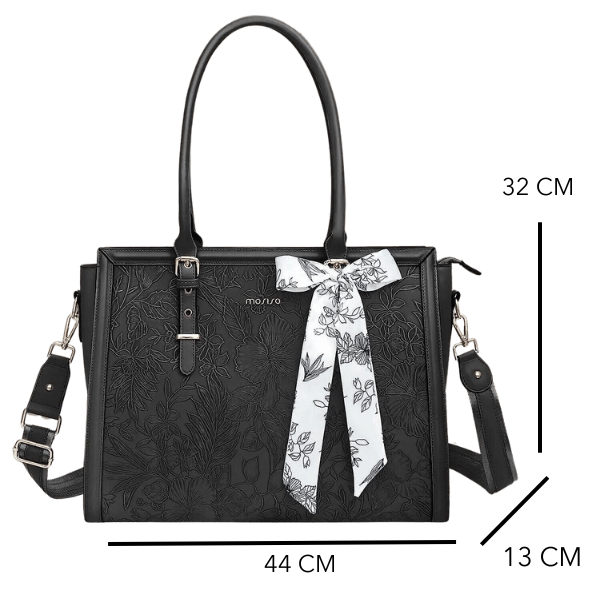 Vue détaillée d'un sac travail femme en cuir PU noir, montrant la texture et les finitions soignées du matériau.