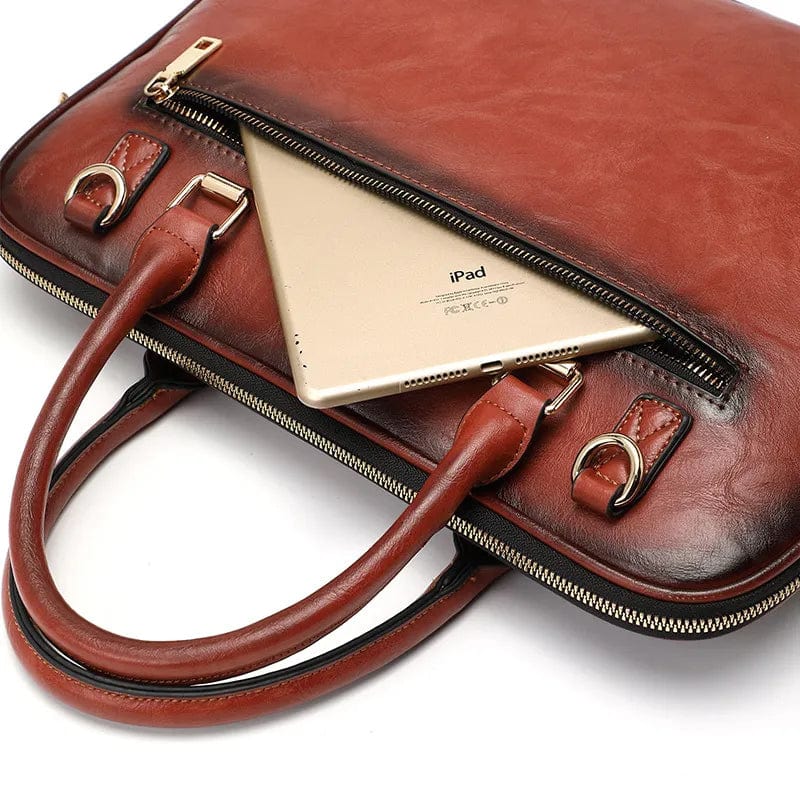 Sac travail femme Ximena noir, cuir fendu, détails dorés, pour ordinateur portable et documents, professionnel.