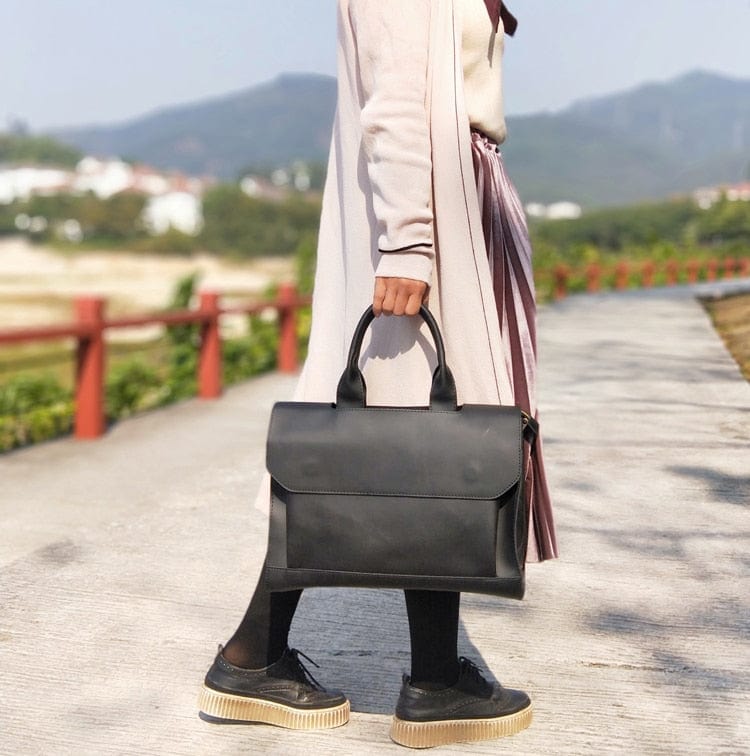 Sac ordinateur élégant noir en cuir PU pour femme, idéal pour le travail.
