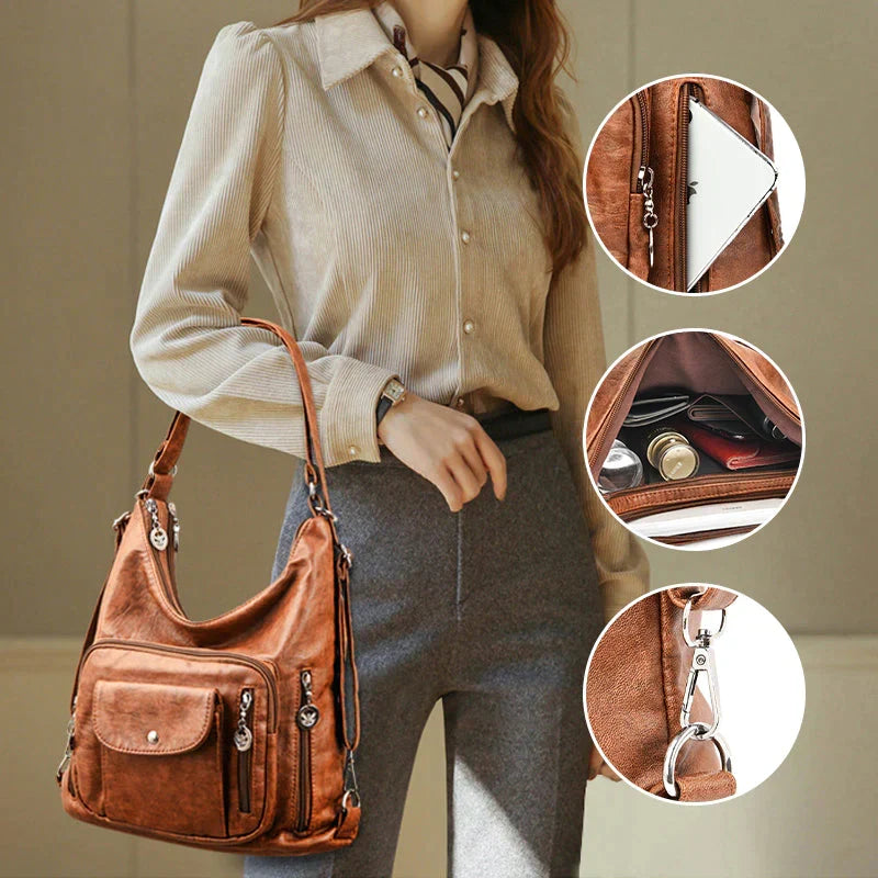 Sac à épaule femme en cuir souple noir, multipoches, idéal pour organisation et usage quotidien chic.