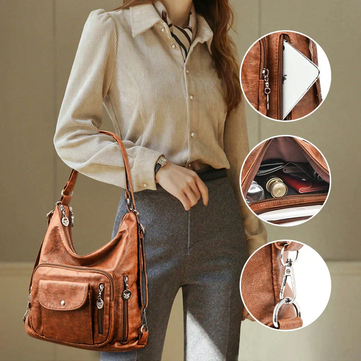 Sac à épaule femme en cuir souple noir, multipoches, idéal pour organisation et usage quotidien chic.