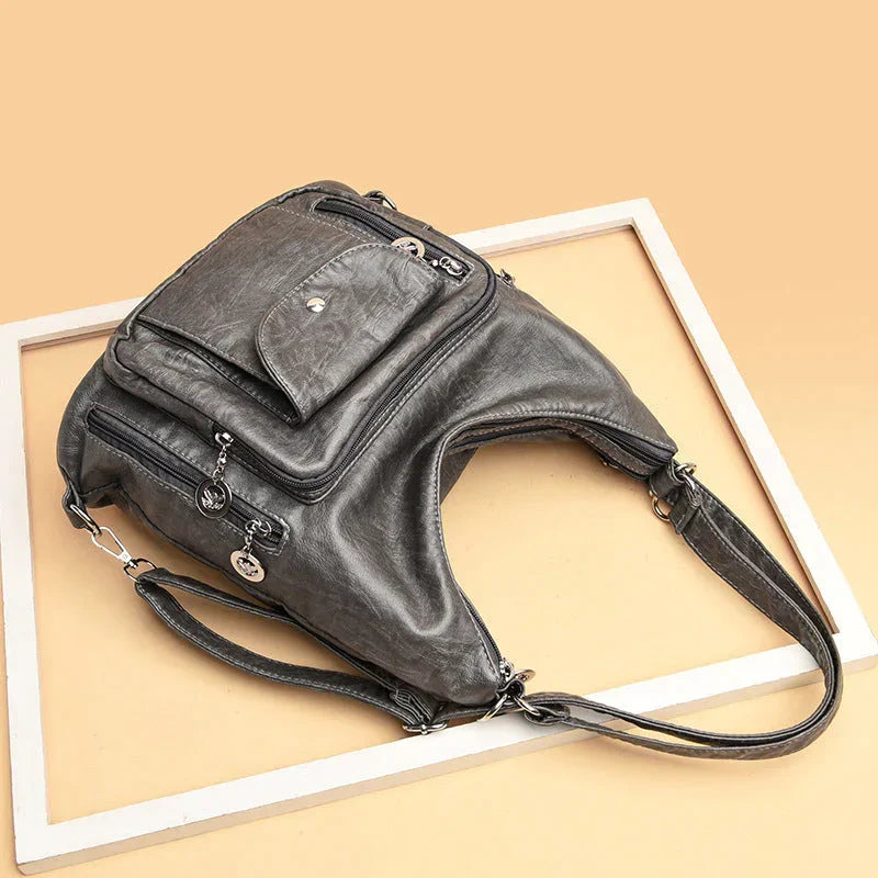 Sac à main femme en cuir souple pour organisation quotidienne, bandoulière ajustable et élégante.