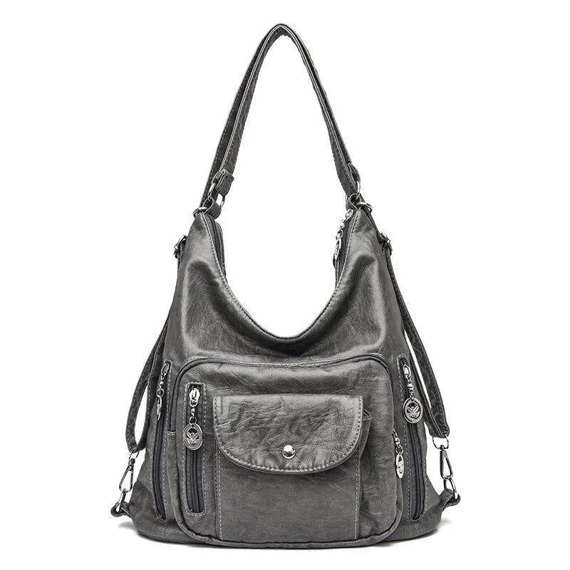 Sac à main femme compact en cuir souple, grande capacité, multipoches discrètes pour organiser.