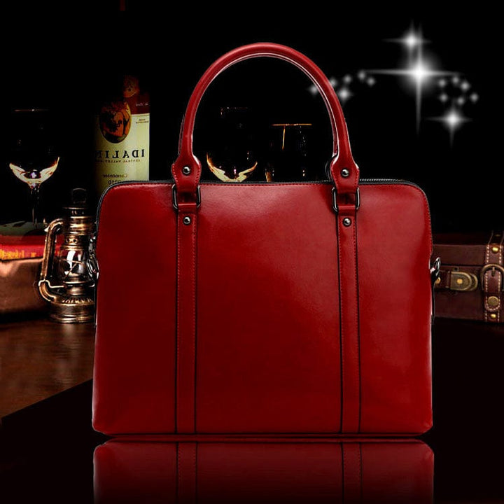 Sac PC portable femme en cuir italien véritable, doublure intérieure soignée, bandoulière amovible.
