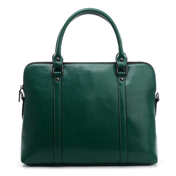 Sac bandoulière en cuir véritable pour femme, design élégant, compatible PC portable, usage bureau.