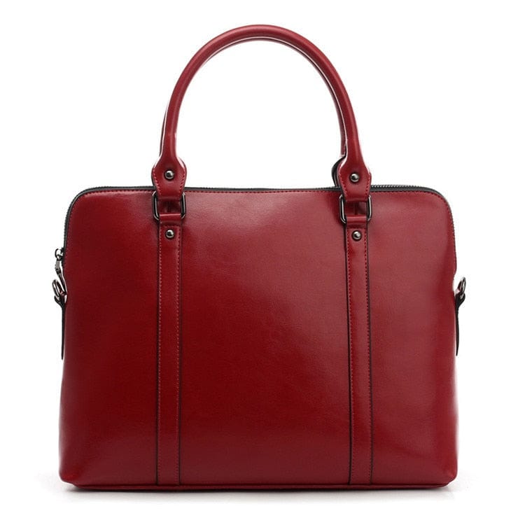 Sac pour PC portable femme en cuir véritable, couleur cognac, lignes épurées et professionnelles.
