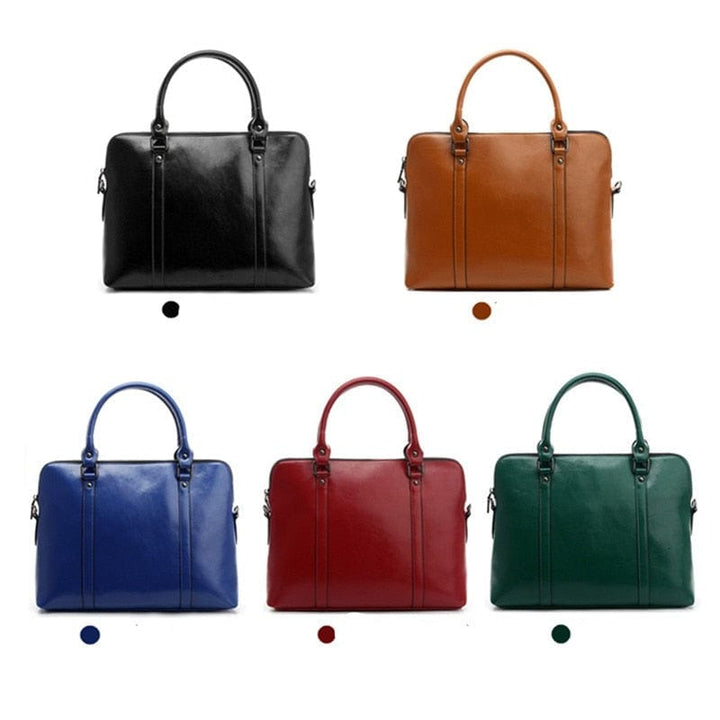 Vue détaillée sac ordinateur en cuir véritable, surpiqûres fines, finition luxe pour femme.