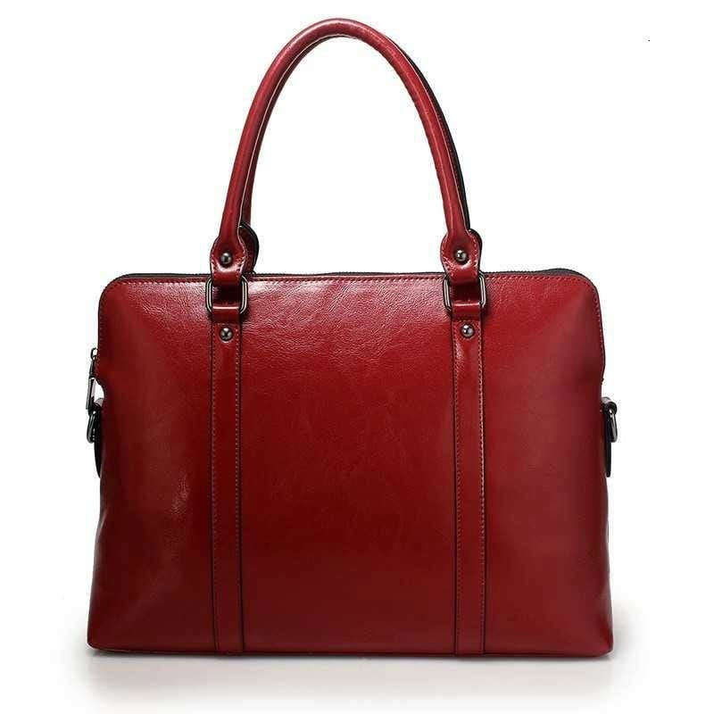 Sac élégant en cuir véritable pour femme, aspect grainé, bandoulière incluse, usage quotidien/travail.