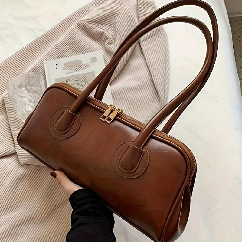 Sac à main noir pour femmes, design chic et moderne, parfait pour le quotidien.