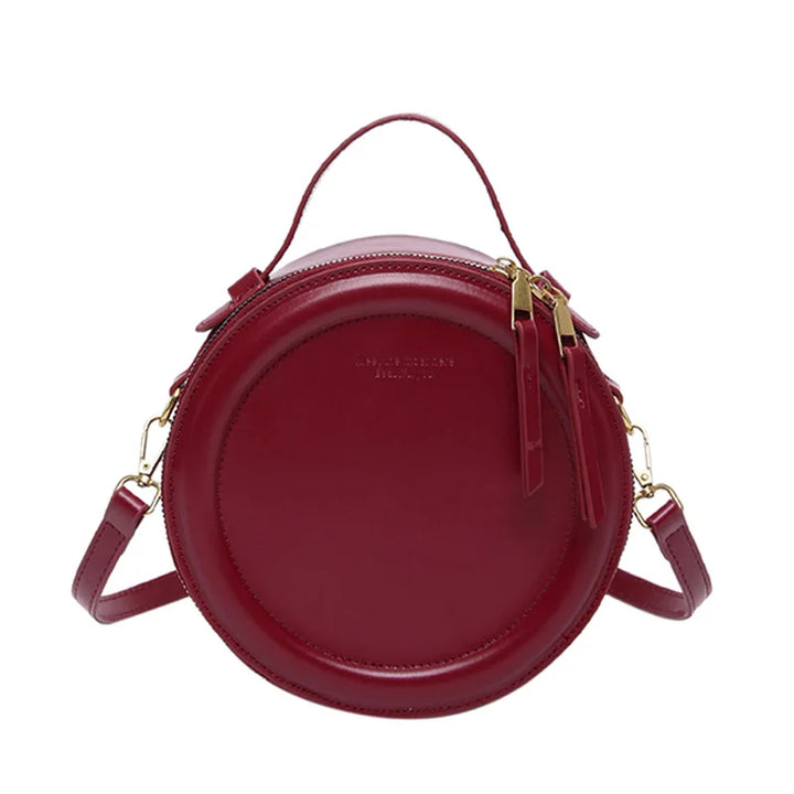 Sac rond femme bandoulière, silhouette épurée, cuir synthétique gris perle, look sophistiqué