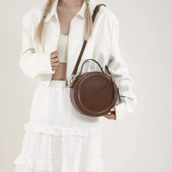 Sac rond femme en bandoulière, design moderne, cuir synthétique marron, pratique et stylé