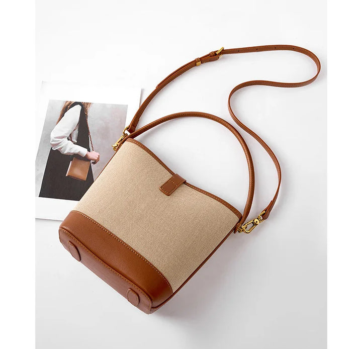 Sac seau moderne pour femme, marron, en cuir synthétique, au style sophistiqué et intemporel.