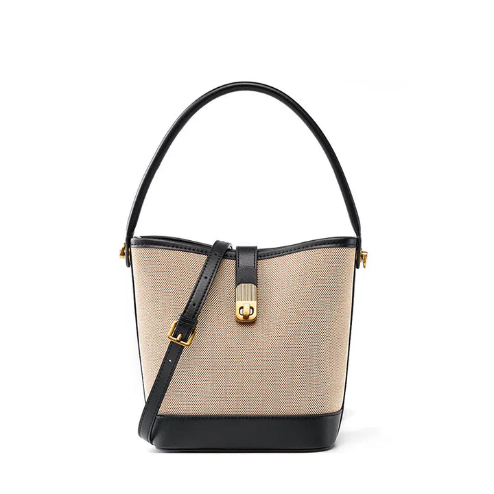 Sac seau mode femme polyvalent en canvas et cuir synthétique noir, accessoire chic et élégant.