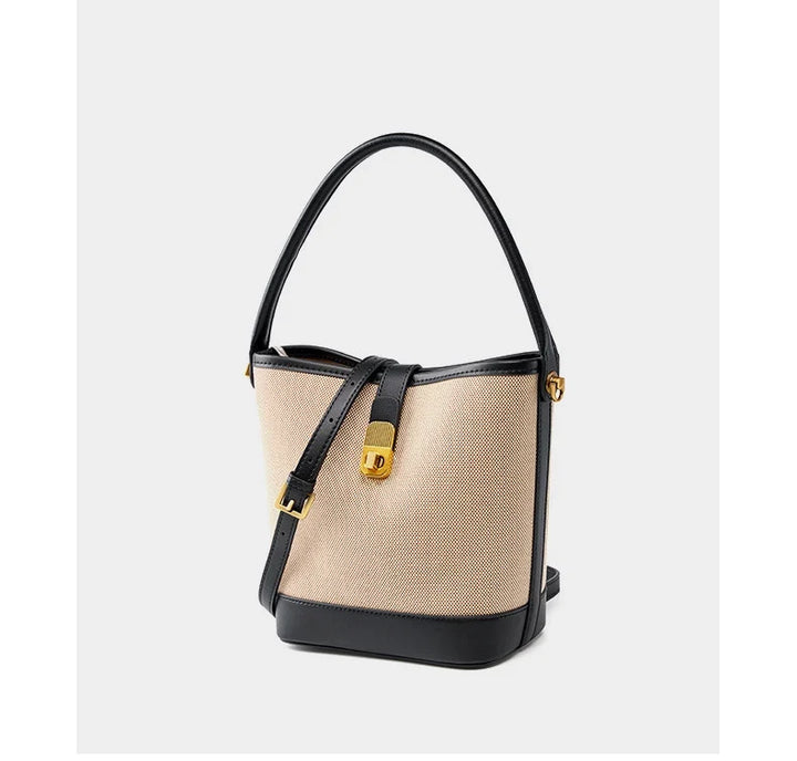 Sac à main seau noir pour femme, style raffiné avec bandoulière réglable, idéal pour toute occasion.