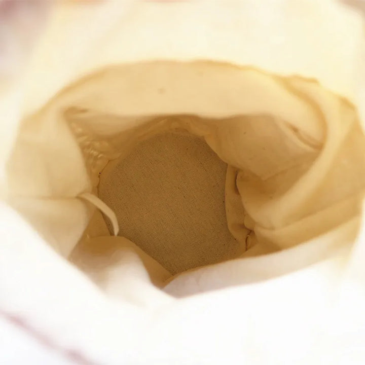 Sac seau léger en paille beige, élégant pour femmes, parfait pour les journées d'été.