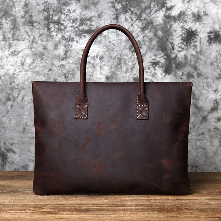 Sacoche homme chic en cuir marron avec fermeture éclair, style business et décontracté