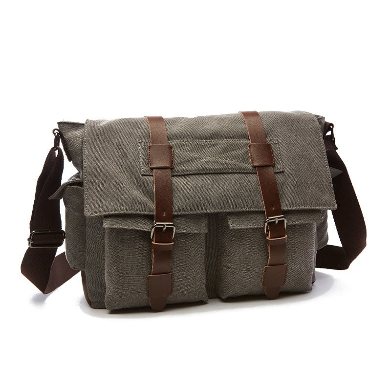 Intérieur spacieux du sac bandoulière vintage homme en toile, multiples compartiments pour organiser vos affaires.