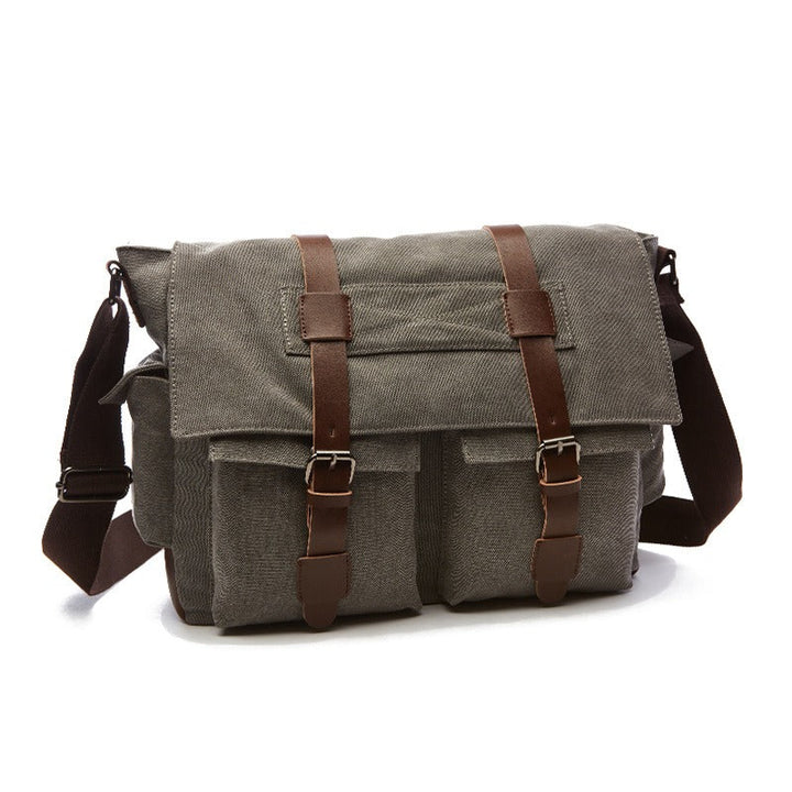 Intérieur spacieux du sac bandoulière vintage homme en toile, multiples compartiments pour organiser vos affaires.