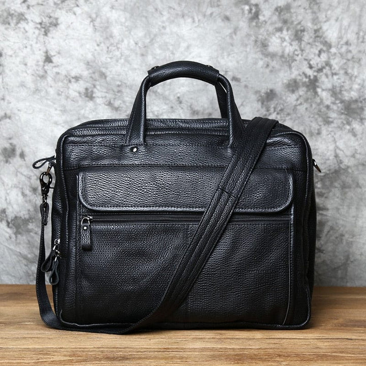 Sacoche ordinateur pour hommes en cuir veritable noir, parfait pour le travail et les affaires. Design elegant et fonctionnel.