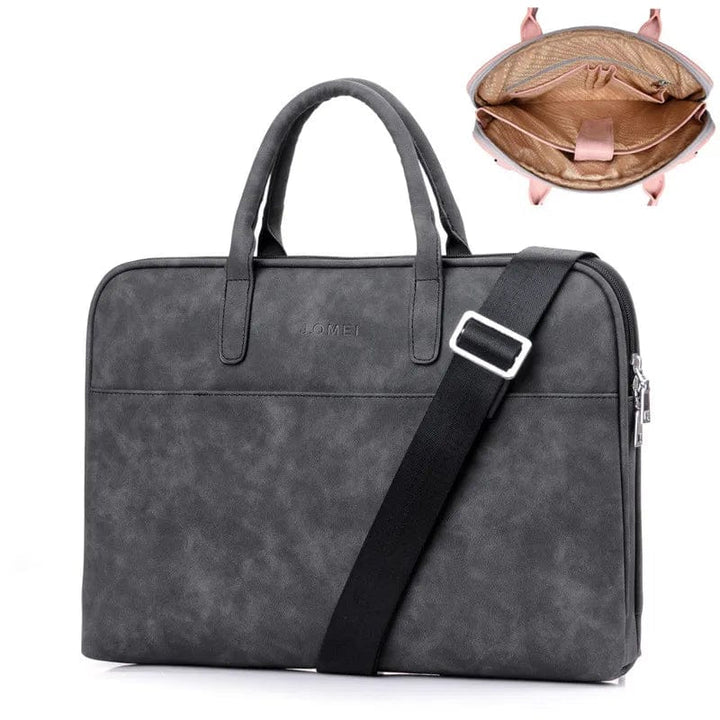 Sac de voyage élégant noir en cuir synthétique, pour ordinateur portable 17 pouces, très pratique.