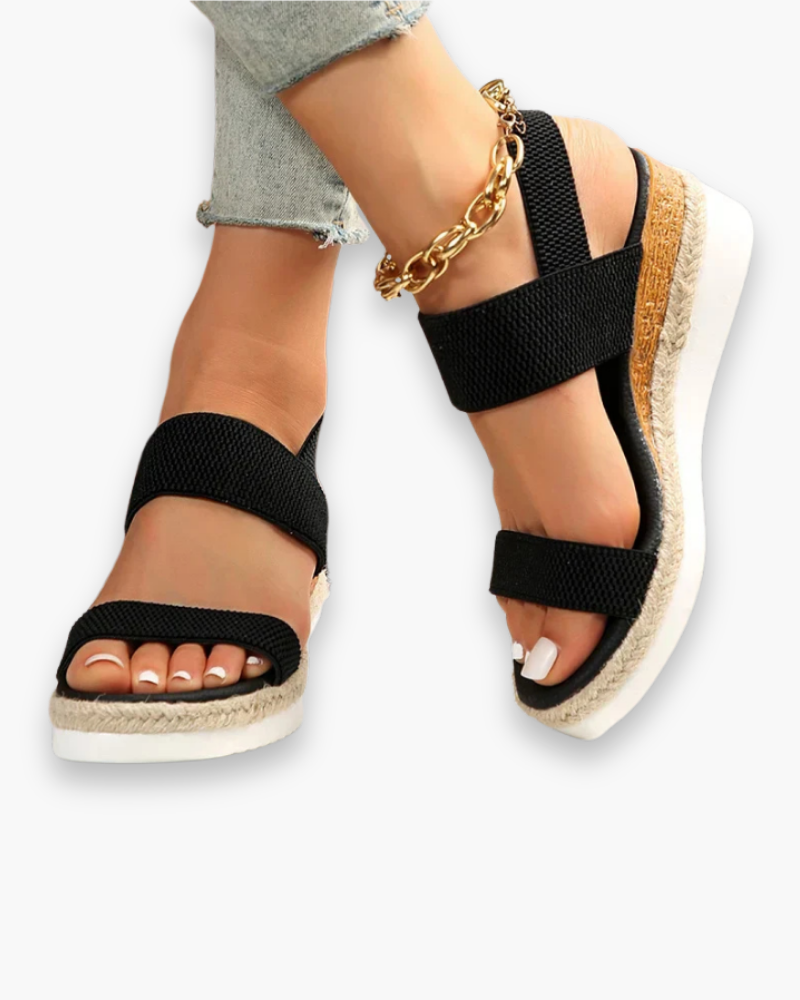 Sandales compensées femme élégantes, talon robuste, bride ajustable, design moderne, confort toute la journée.