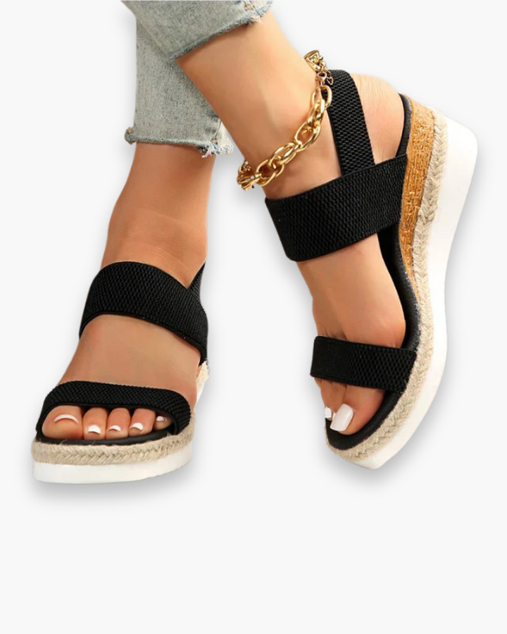 Sandales compensées femme élégantes, talon robuste, bride ajustable, design moderne, confort toute la journée.