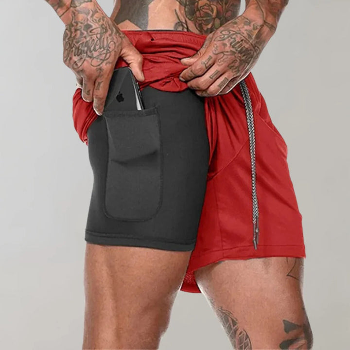 Short d'entraînement noir pour homme, respirant, compression et poches, parfait pour le fitness.