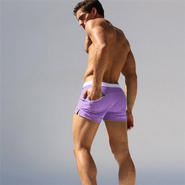 "Short de bain homme confortable, séchage rapide, design urbain élégant, tissu élastique pour liberté de mouvement."