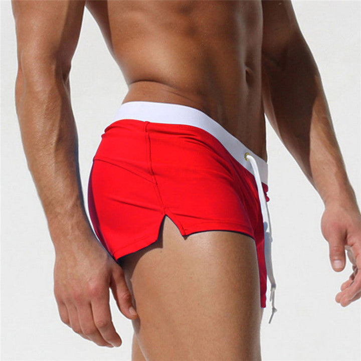 "Short de bain homme confortable, séchage rapide, design urbain élégant, tissu élastique pour liberté de mouvement."