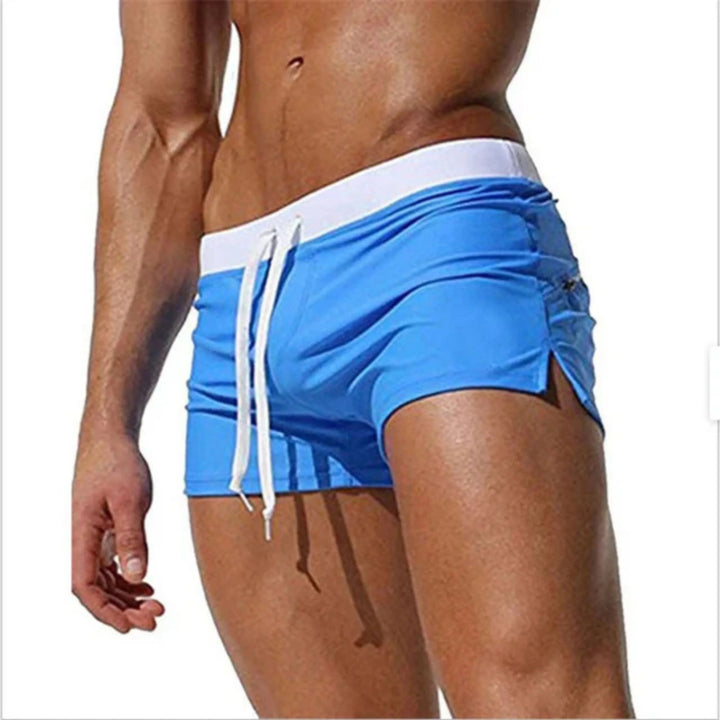 "Short de bain homme séchage rapide, taille ajustable, tissu léger et respirant, couleurs vibrantes, été piscine plage."