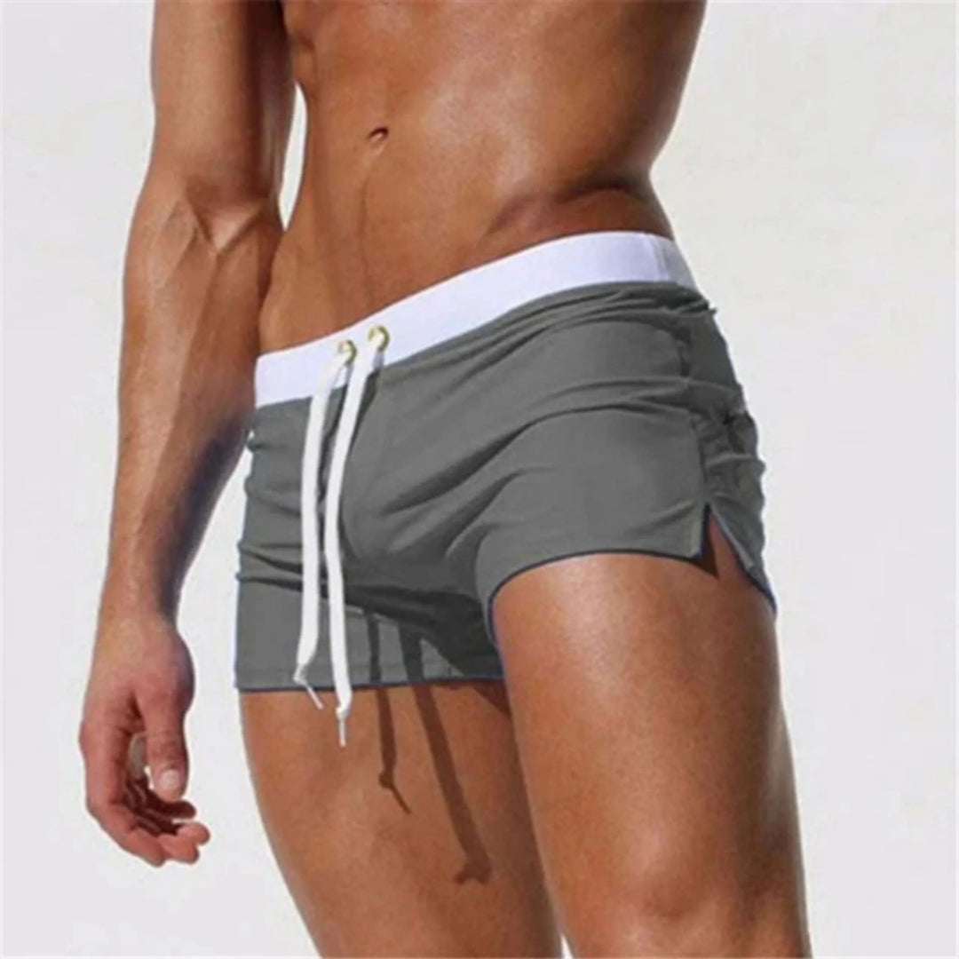 "Short de bain homme séchage rapide, taille ajustable, tissu léger et respirant, couleurs vibrantes, été piscine plage."