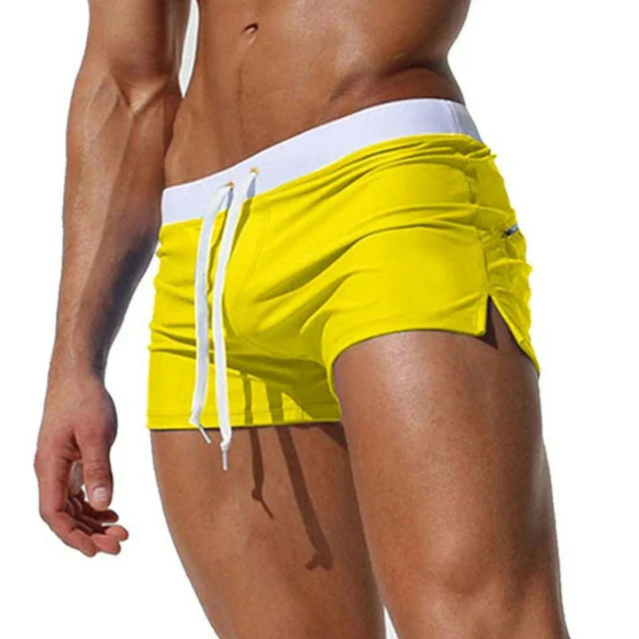 "Short de bain homme séchage rapide, taille ajustable, tissu léger et respirant, couleurs vibrantes, été piscine plage."