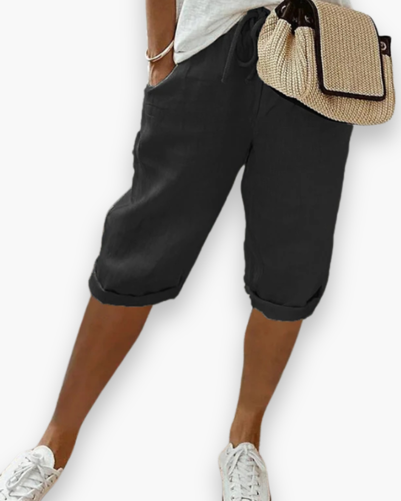 "Short femme confortable et respirant, style décontracté, tissu léger, disponible en plusieurs couleurs, idéal pour l'été."