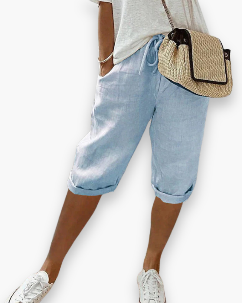 "Short femme confortable et respirant, style décontracté, tissu léger, disponible en plusieurs couleurs, idéal pour l'été."