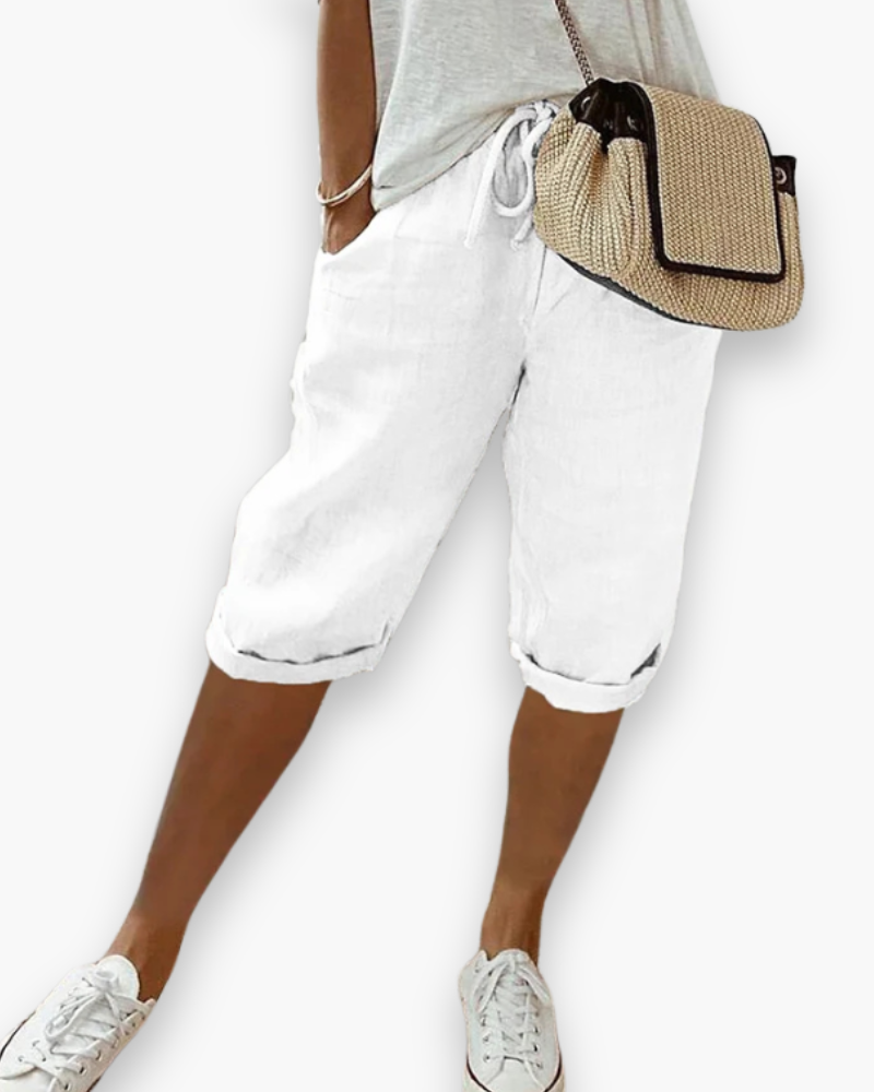 "Short femme confortable et respirant, style décontracté, tissu léger, disponible en plusieurs couleurs, idéal pour l'été."