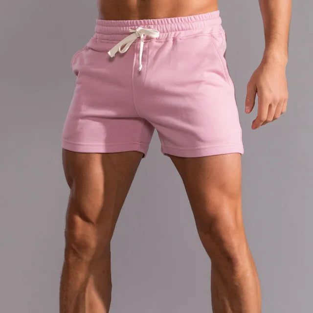 "Short homme été Lucien en coton, style décontracté élégant, couleurs variées, coupe ample et cordon ajustable."