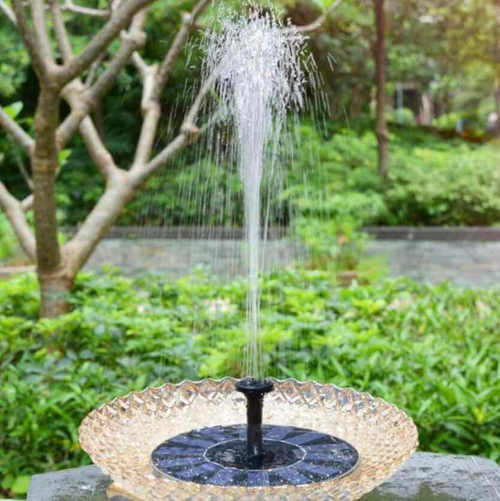 Solar-powered mini garden fountain. Elegant design, attracts birds. Easy installation, eco-friendly.