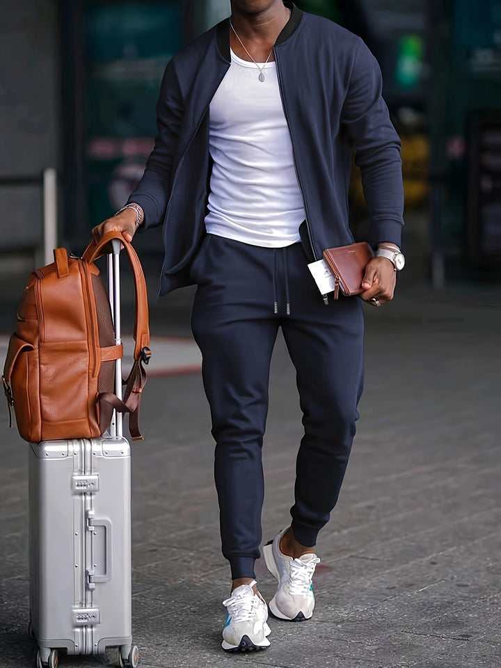 Veste zippée et pantalon jogging pour homme, tenue athlétique polyvalente pour le sport et le style athleisure.