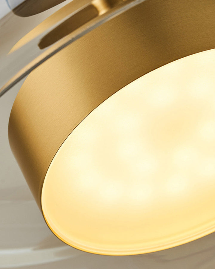 Suspension lumineuse en verre soufflé, design élégant et moderne.  Luminaire intérieur, forme tambour, ambiance chaleureuse.